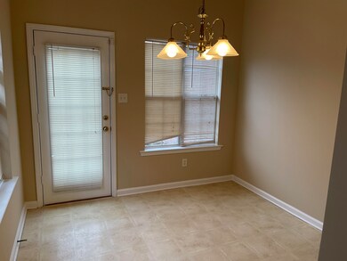 Doorway to outside with a chandelier