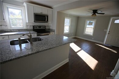 new white cabinetry, granite counters