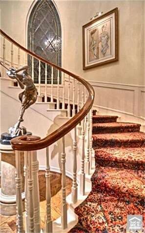 Main spiral stairway with art lighting