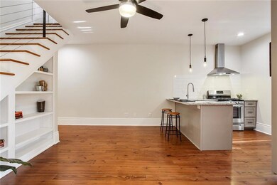 Another view showing the kitchen. The downstairs b