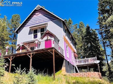 Back of property with a wooden deck