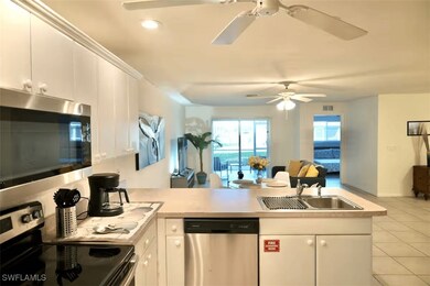 Kitchen featuring stainless steel appliances, a si