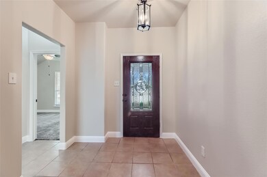 Entryway featuring light tile floors