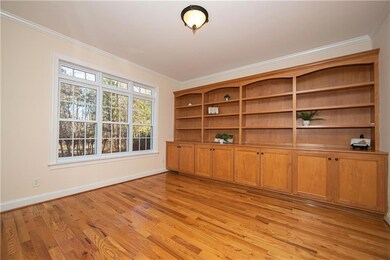 Glass double french doors lead you to the Office w