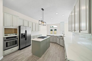 View from the kitchen into the breakfast area. Breakfast area is featured with french doors opening to the back yard bringing in more natural light.
