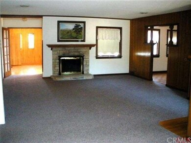 Large livingroom with fireplace. Straight back is 
