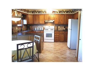 Updated eat-in Kitchen. New granite counters, tile