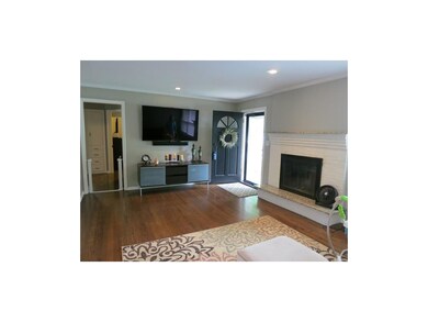 Gorgeous hardwood floors, crown moulding and reces