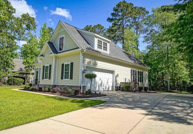View of front of home featuring roof with shingles