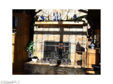 Den/Family/Great Room. Massive double sided woodburning fireplace.