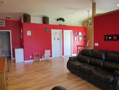 Features wide-plank handscraped hardwood flooring,