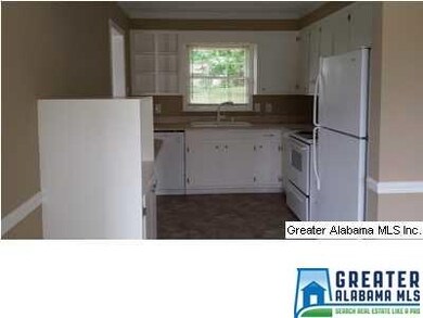 Kitchen from eating area. New paint, floors and co