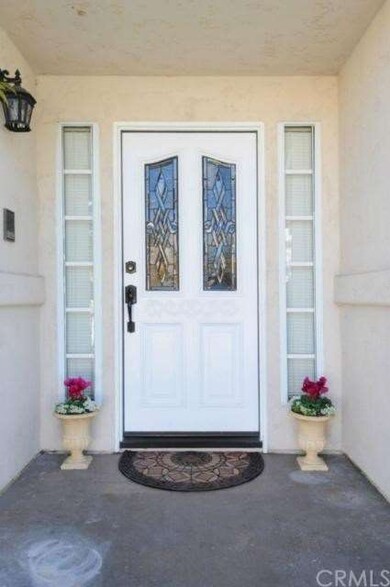 Elegant front door continues to an inviting entryw
