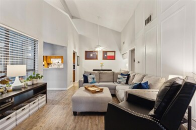 Living room featuring high vaulted ceiling, ceilin
