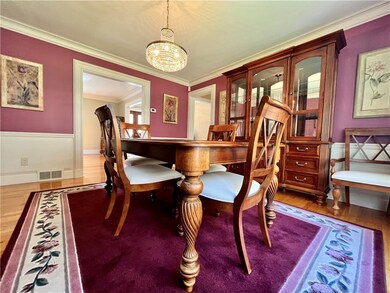 Paneled walls & crown molding adorns this setting