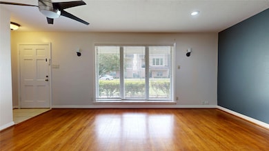 This inviting living room features bay windows tha