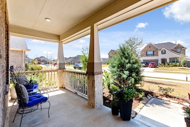 Enjoy a glass of iced tea on a hot summer day or your morning coffee on this amazing front porch!