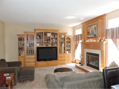This large family room is warmed by fireplace and 