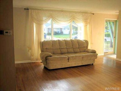 Living Room. Wonderful hardwood floors, large pict