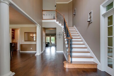 Upon entering the home there is an open foyer and one of stairways leading to the second floor. 