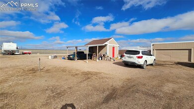 View of outdoor structure featuring an outbuilding