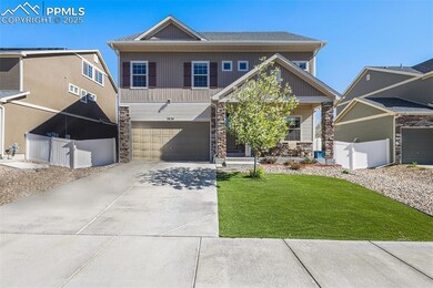 Craftsman-style home featuring covered porch, driv