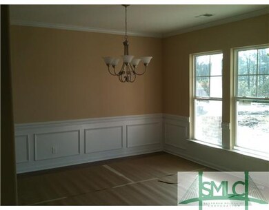 Dining Room. Separate dining room with crown moldi