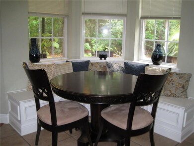 Cozy breakfast area with built-in seating and view