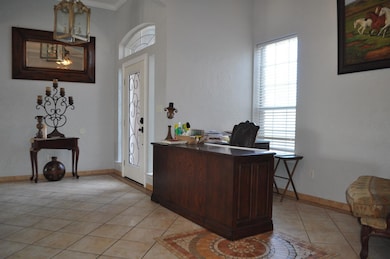 Foyer entrance with light tile flooring