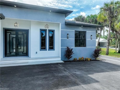 Doorway to property with stucco siding