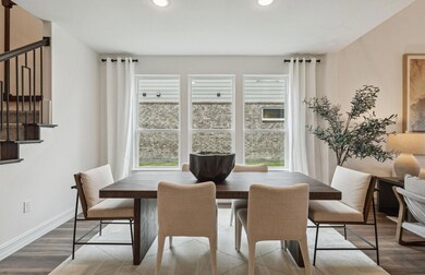 Airy dining area *Photos of furnished model. Not a