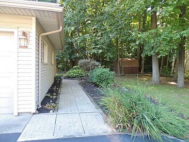 Exterior Front landscaped all around the garage to