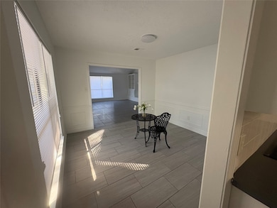 other view of the dinning room from kitchen entrance.