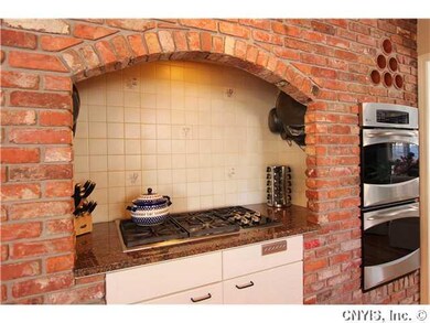 Kitchen. This 5 burner Wolf gas cooktop with retra