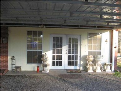 Entrance from double carport.