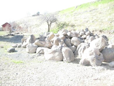 Boulders for retaining wall