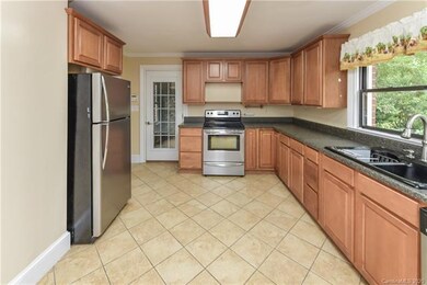 Kitchen with Door leading out to Utility Room