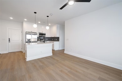 Kitchen with stainless steel appliances, light co