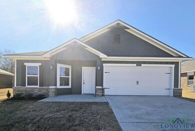 View of front of house featuring a garage and cent