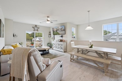 Living room with healthy amount of natural light & vinyl plank floors.