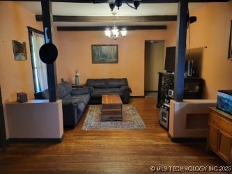 Living room boasts attractive beamed ceiling.