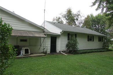 Back of the house.  Breezeway back door.  To the r
