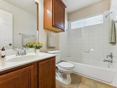 Full bath featuring vanity and shower / bath comb