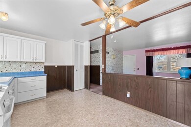 Kitchen has pantry and open sightlines to livingro