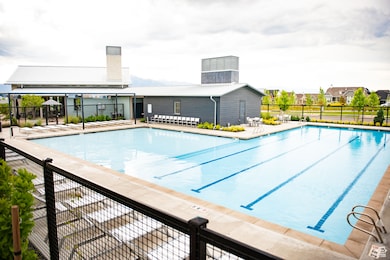 Community pool with a patio