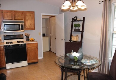 This view of the kitchen shows how the kitchen opens into the laundry room and you can also see the doorway into the garage.  Easy access to the garage makes bringing in groceries an easy task.