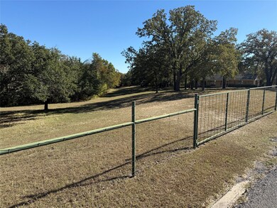 View of home's community with a gate and a view of countryside