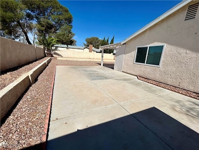 Fenced backyard with a patio