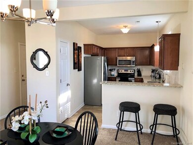 View from dining to kitchen and hallway to garage 