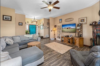 Living room with dark hardwood / wood-style floori